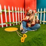 Woman With Orange Headband Holding A Tambourine