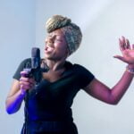 Photo of Woman Singing in Music Studio