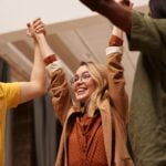 Group of People Holding Their Hands Up